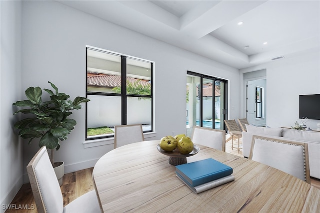 dining area with wood-type flooring