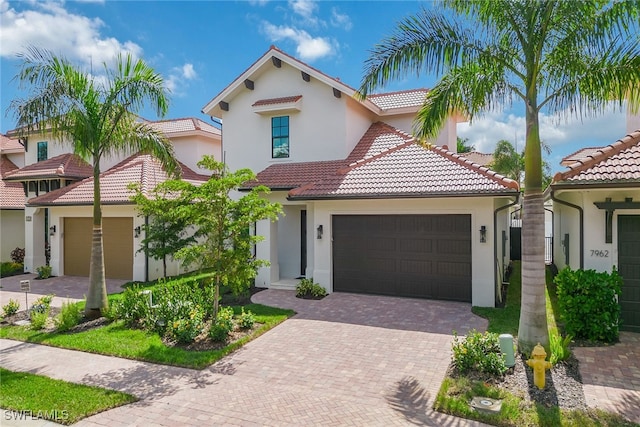 mediterranean / spanish-style house featuring a garage