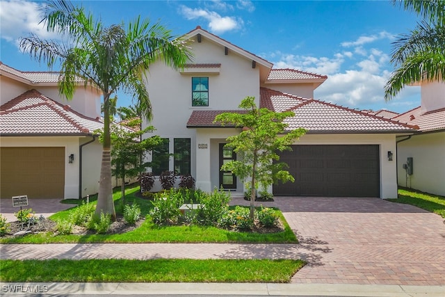 mediterranean / spanish-style house featuring a garage