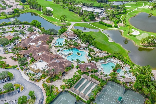 birds eye view of property with a water view