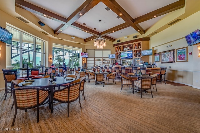 dining space with coffered ceiling, a chandelier, carpet, and beam ceiling