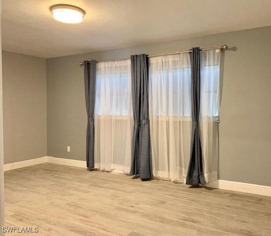 unfurnished room featuring light wood-type flooring