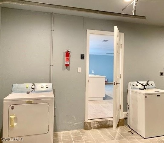 laundry room with washer and clothes dryer