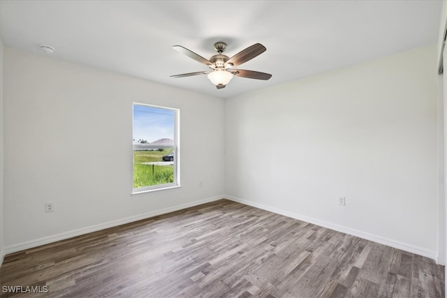 unfurnished room featuring ceiling fan and light hardwood / wood-style floors