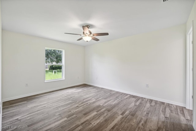 unfurnished room featuring light hardwood / wood-style floors and ceiling fan