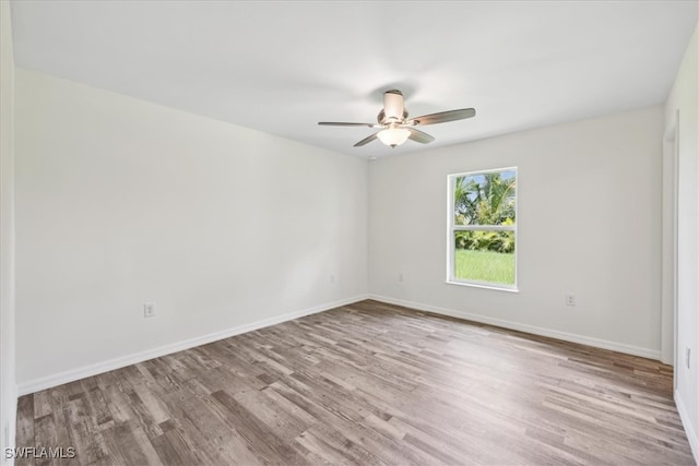 unfurnished room featuring ceiling fan and light wood-type flooring