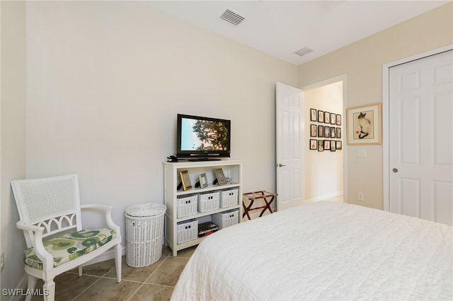 bedroom featuring light tile patterned floors