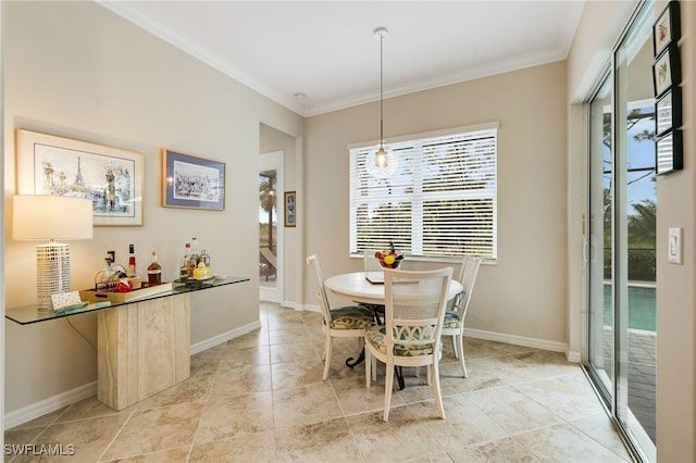 dining area with crown molding