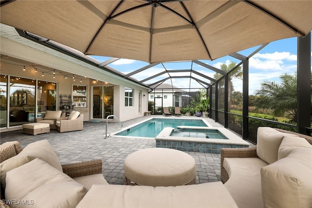 view of swimming pool featuring outdoor lounge area, glass enclosure, a patio area, and an in ground hot tub