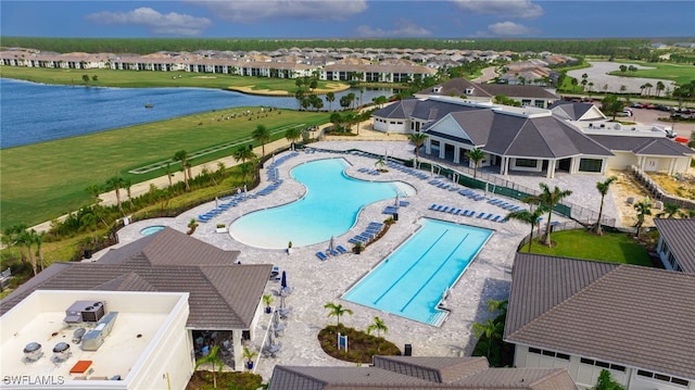 view of pool with a water view