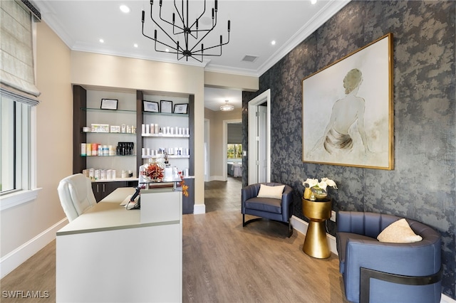 office area featuring crown molding, hardwood / wood-style floors, and a chandelier