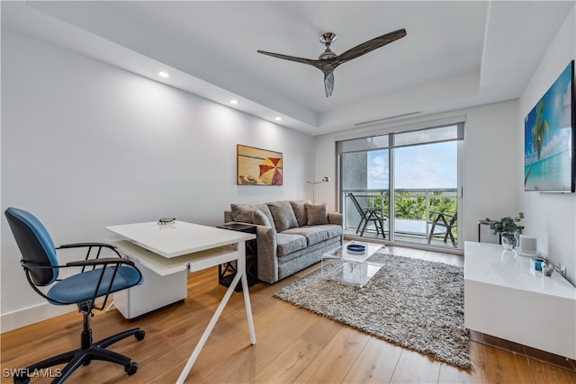 office space featuring hardwood / wood-style floors and ceiling fan