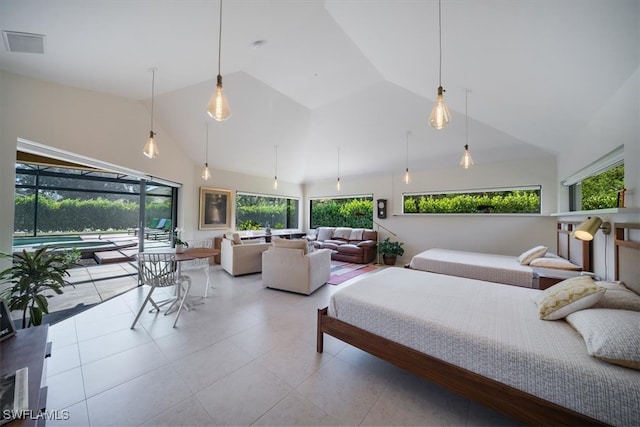 bedroom featuring high vaulted ceiling