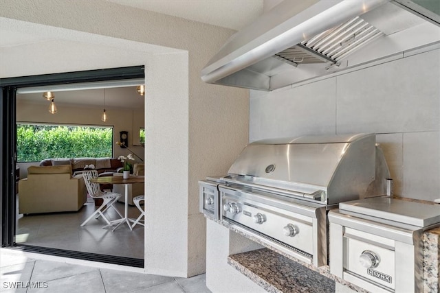 view of patio / terrace featuring area for grilling and a grill