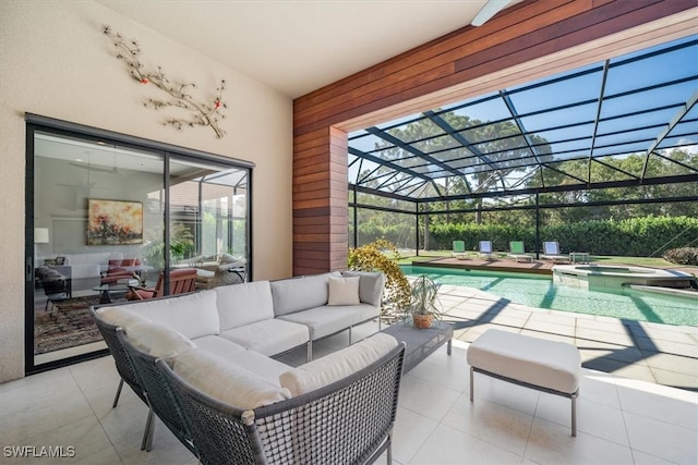 view of patio / terrace featuring a pool with hot tub, an outdoor living space, and a lanai