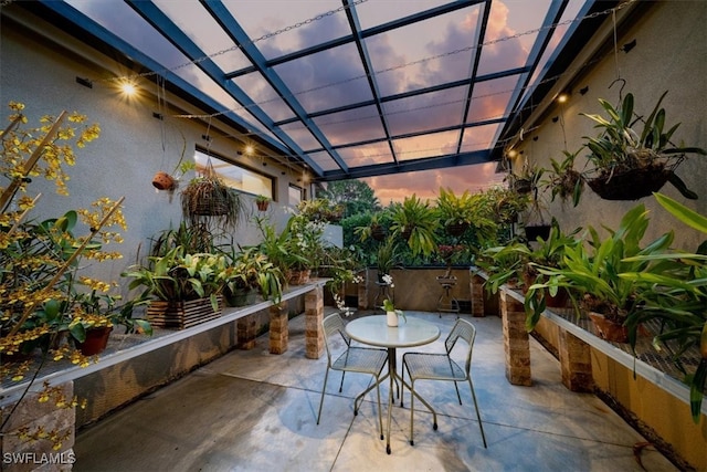 view of patio terrace at dusk