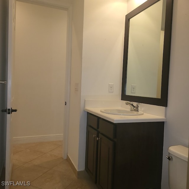 bathroom featuring vanity, toilet, and tile patterned floors