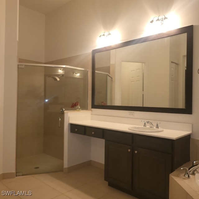 bathroom featuring tile patterned flooring, vanity, and separate shower and tub