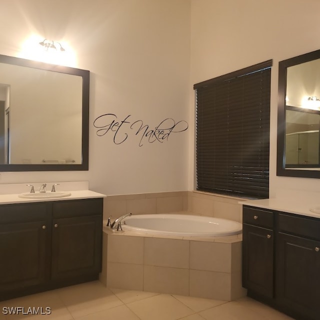 bathroom featuring shower with separate bathtub, vanity, and tile patterned floors