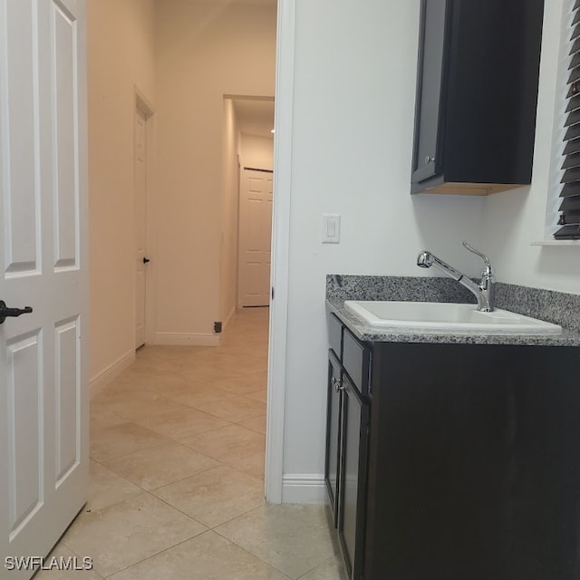 bathroom featuring tile patterned floors and vanity