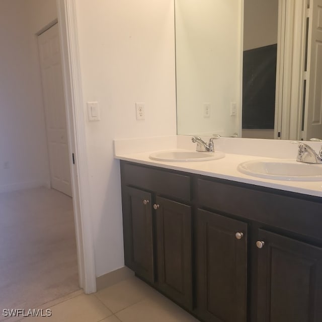 bathroom with tile patterned flooring and vanity