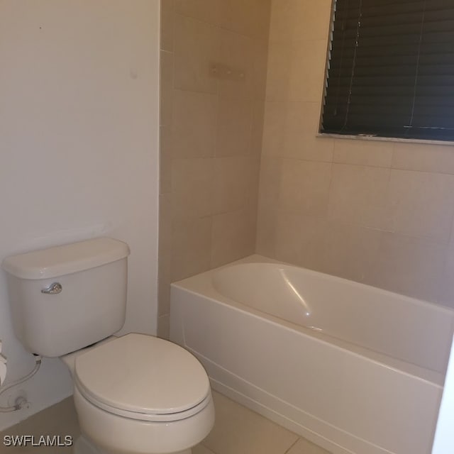 bathroom featuring toilet and tile patterned floors