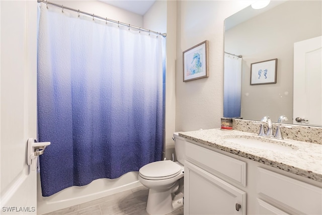 full bathroom featuring shower / bathtub combination with curtain, vanity, and toilet