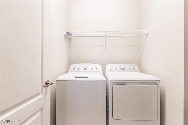 washroom featuring independent washer and dryer