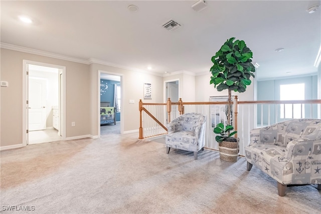 sitting room with light carpet and ornamental molding