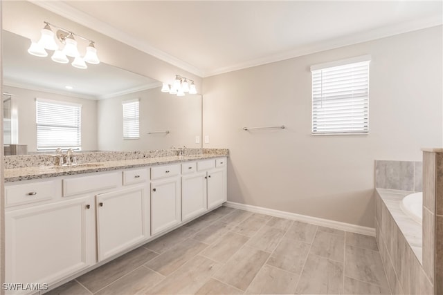 bathroom with a relaxing tiled tub, vanity, and crown molding