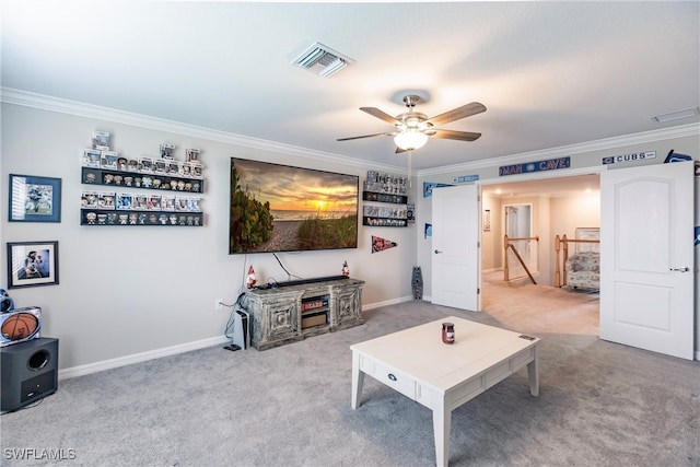 living room with carpet floors, crown molding, and ceiling fan