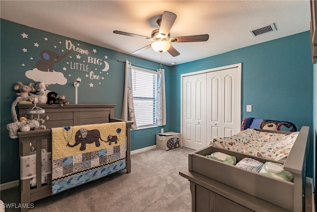 carpeted bedroom with a closet and ceiling fan