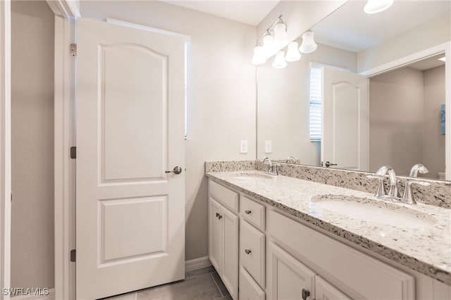 bathroom featuring tile patterned floors and vanity