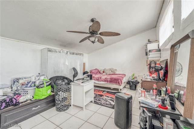 tiled bedroom with ceiling fan