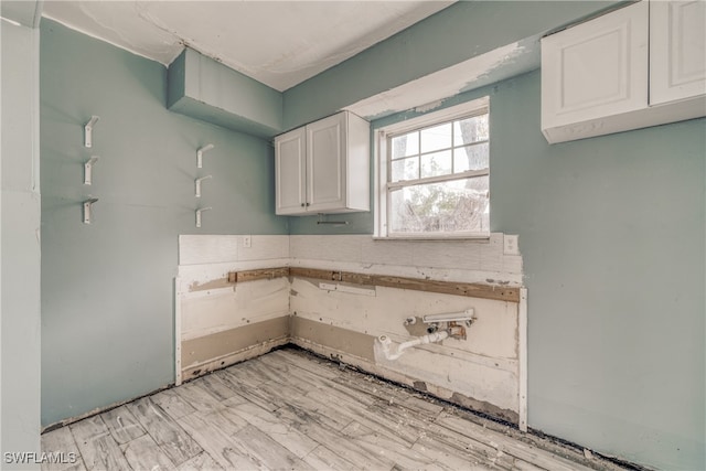 kitchen featuring white cabinets