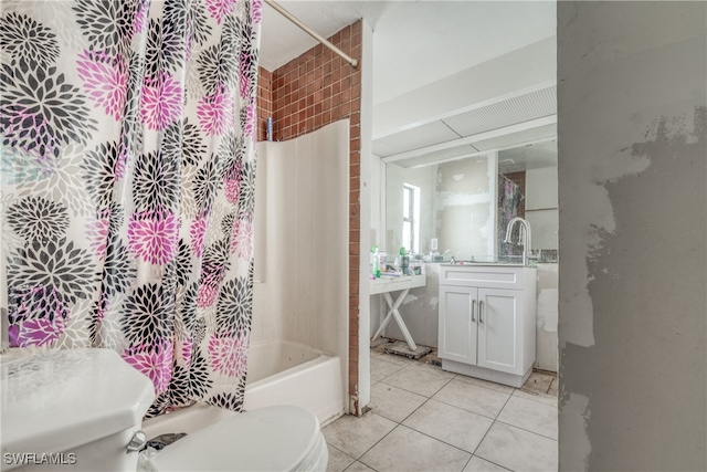 full bathroom featuring vanity, tile patterned flooring, toilet, and shower / bath combo