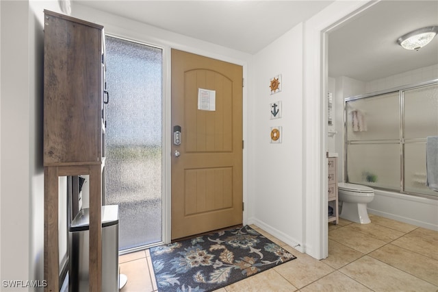 foyer entrance featuring light tile patterned floors