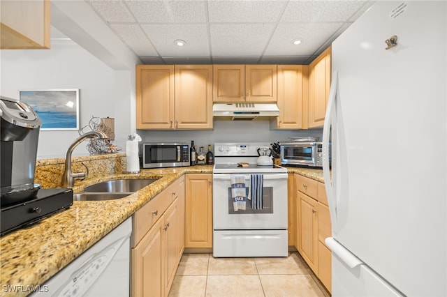 kitchen with sink, a paneled ceiling, white appliances, light brown cabinets, and light tile patterned floors