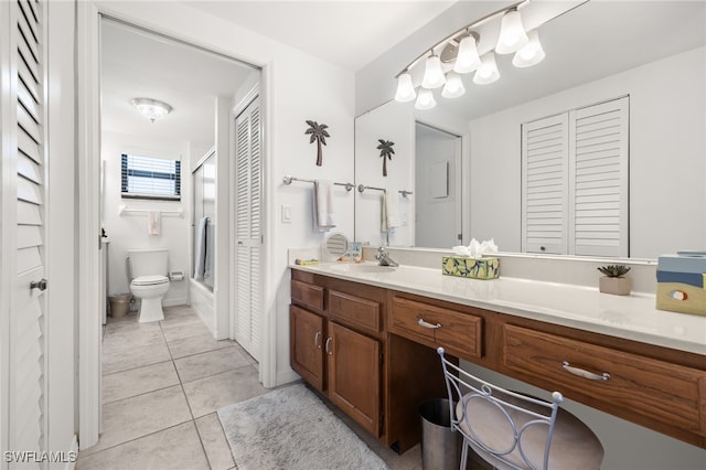 bathroom with an enclosed shower, vanity, toilet, and tile patterned floors