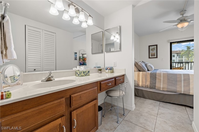 bathroom featuring ceiling fan, vanity, and tile patterned flooring