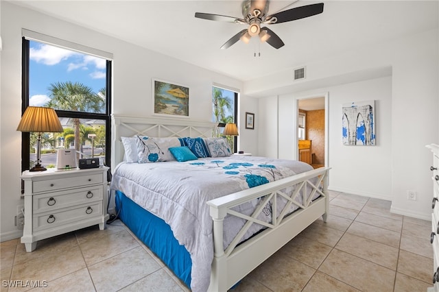 tiled bedroom with ceiling fan