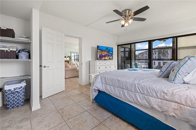 bedroom featuring tile patterned flooring and ceiling fan