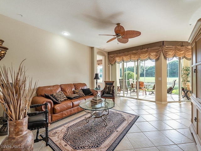 living room featuring ceiling fan and light tile patterned floors