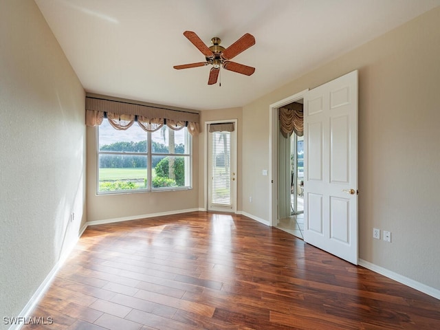 spare room featuring hardwood / wood-style flooring and ceiling fan