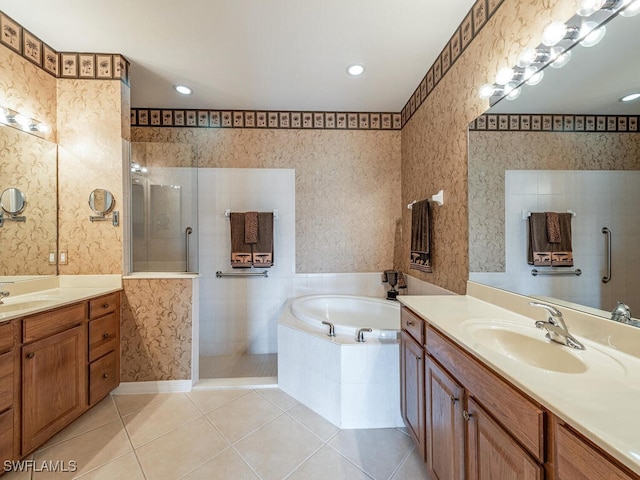 bathroom with tile patterned floors, vanity, and independent shower and bath