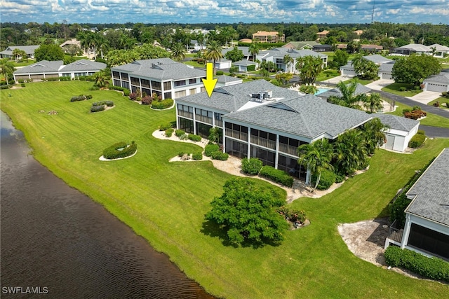 bird's eye view with a water view