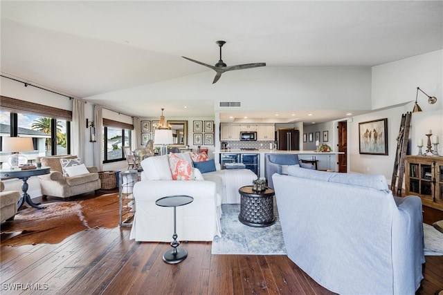 living room featuring dark wood-type flooring, ceiling fan, and lofted ceiling