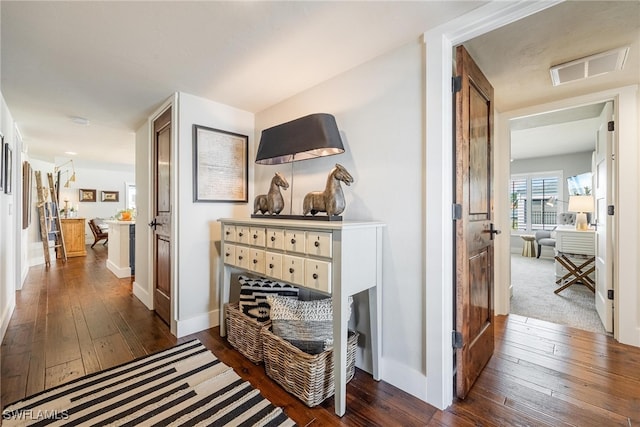 hall with dark hardwood / wood-style floors