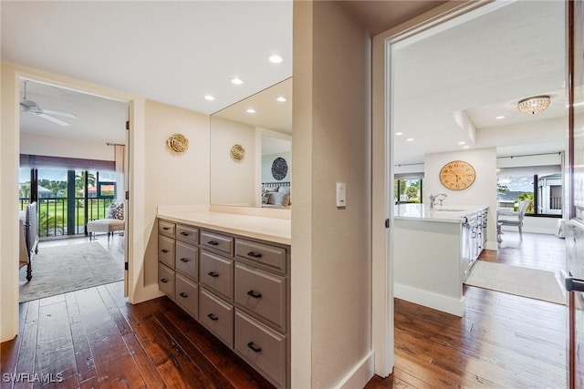 bathroom featuring hardwood / wood-style flooring, ceiling fan, and vanity