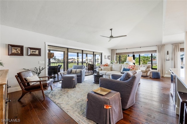 living room with ceiling fan and dark hardwood / wood-style floors